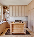 compressed board wooden cabinets and a hood
