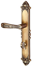 Decorative brass door handle on a white background