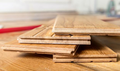 Close-up of wooden flooring panels with a blurred background