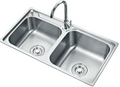 Stainless steel kitchen sink on a white background